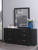 dark wood daytona dresser styled with matching mirror, as well as decorative objects and a blue vase with white flowers