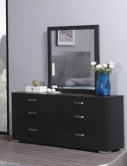 dark wood daytona dresser styled with matching mirror, as well as decorative objects and a blue vase with white flowers