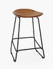 three quarter view of backless wood stool with metal bars and legs