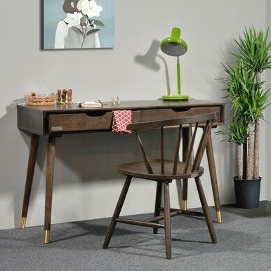 simple walnut desk with two drawers and gold-tone details at bottom